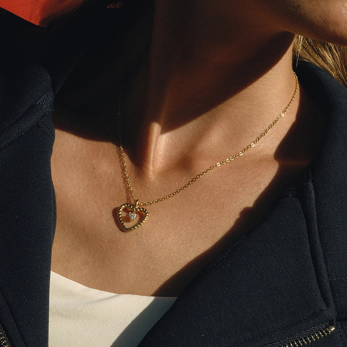 Collier pendentif cœur torsadé en acier inoxydable avec strass