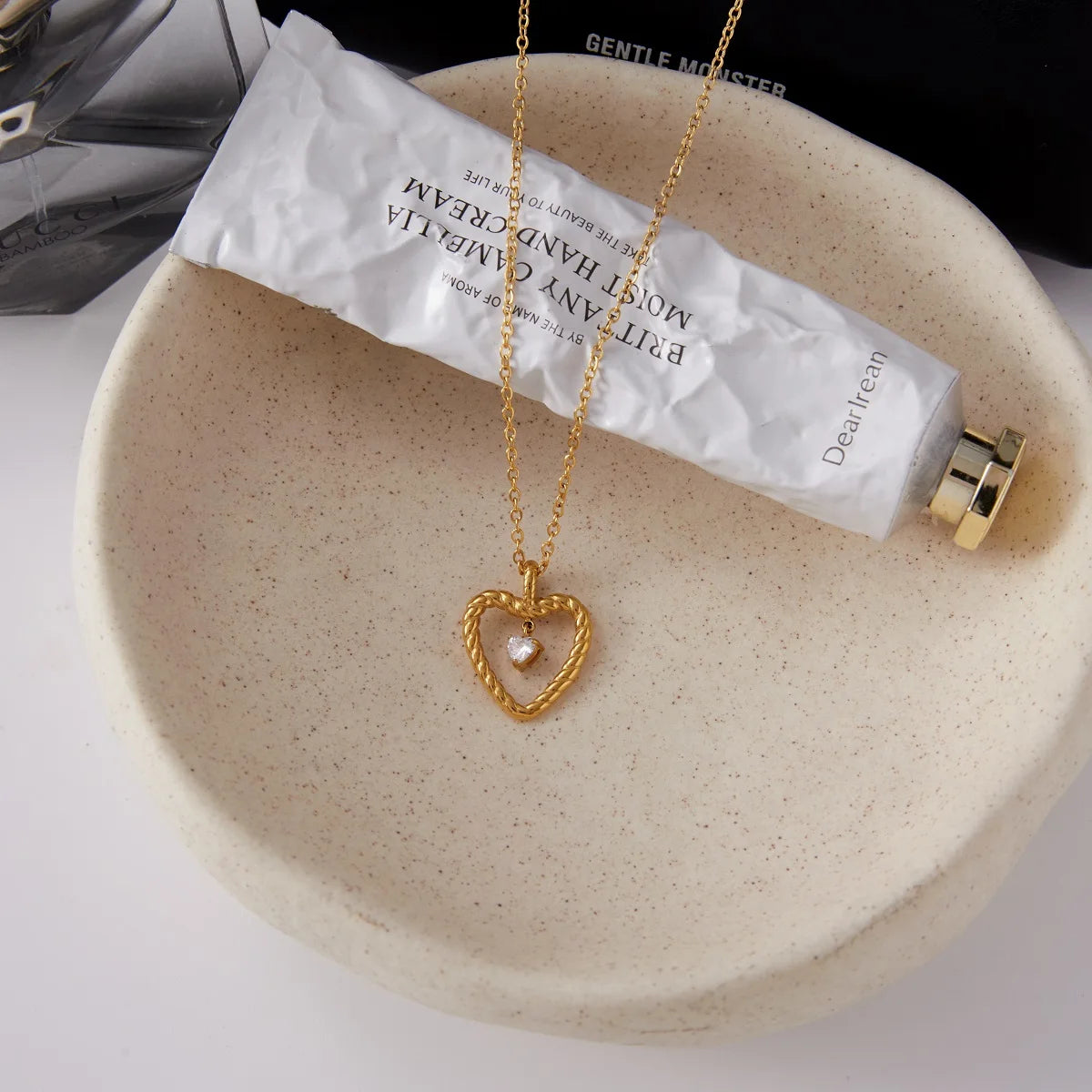 Collier pendentif cœur torsadé en acier inoxydable avec strass