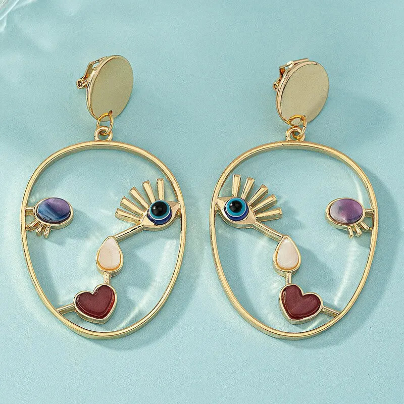 Boucles d’oreilles pendantes visage abstrait